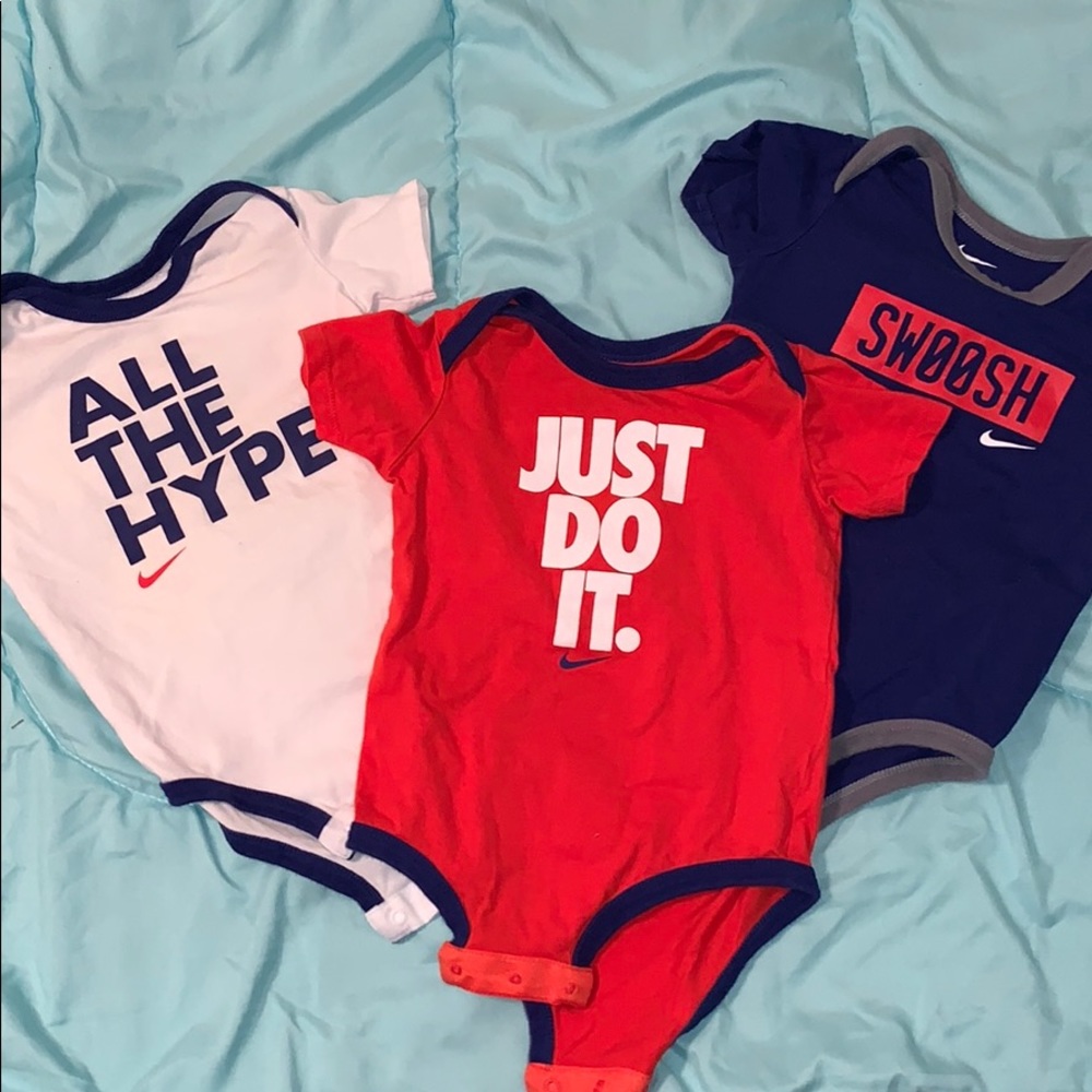 Set of 3 Nike slogan onesies. 9/12 month.